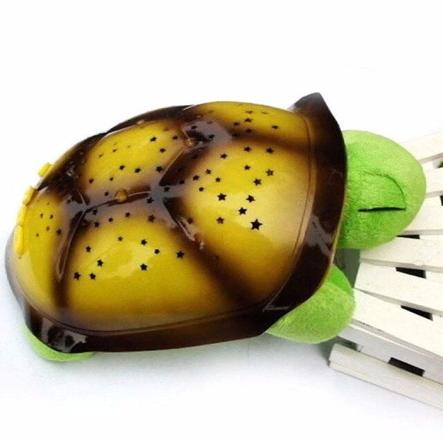 Veilleuse à projections lumineuses en forme de tortue.